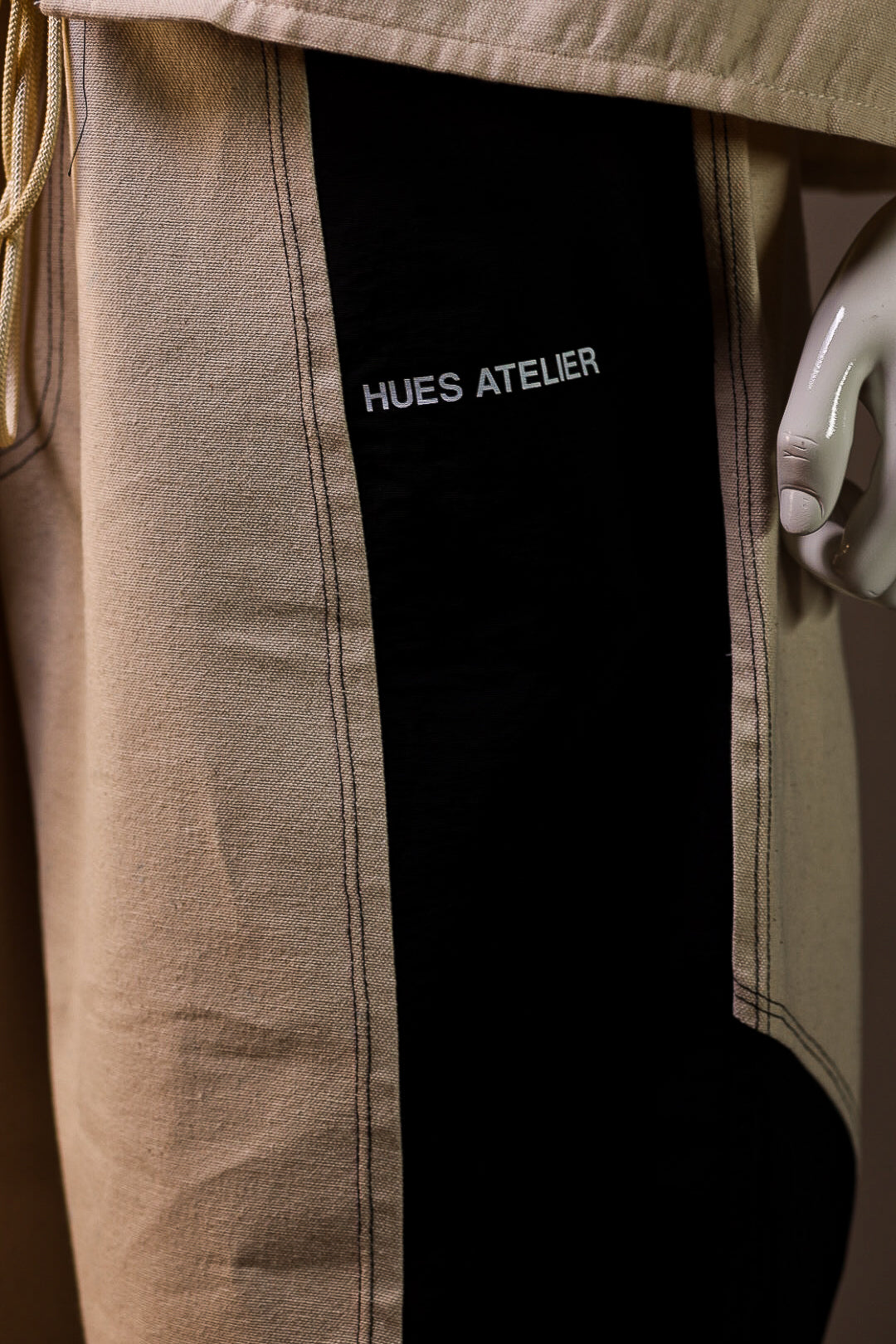 Hues Atelier track pants logo and texture