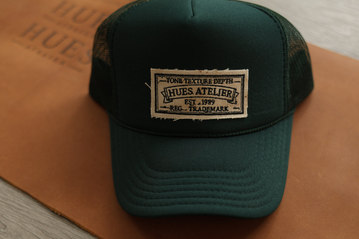 Green Hues Atelier Trucker Hat with front embroidered patch