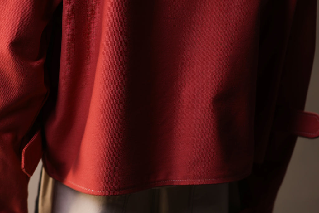 Close-up of a red garment with a blurred background