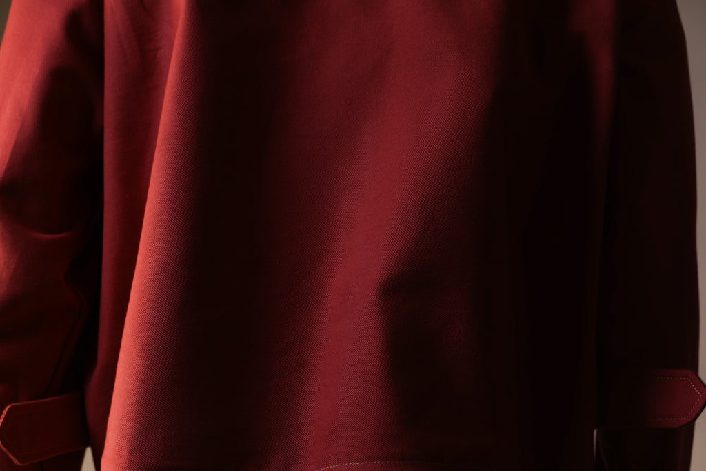 Close-up of a red garment with a plain background