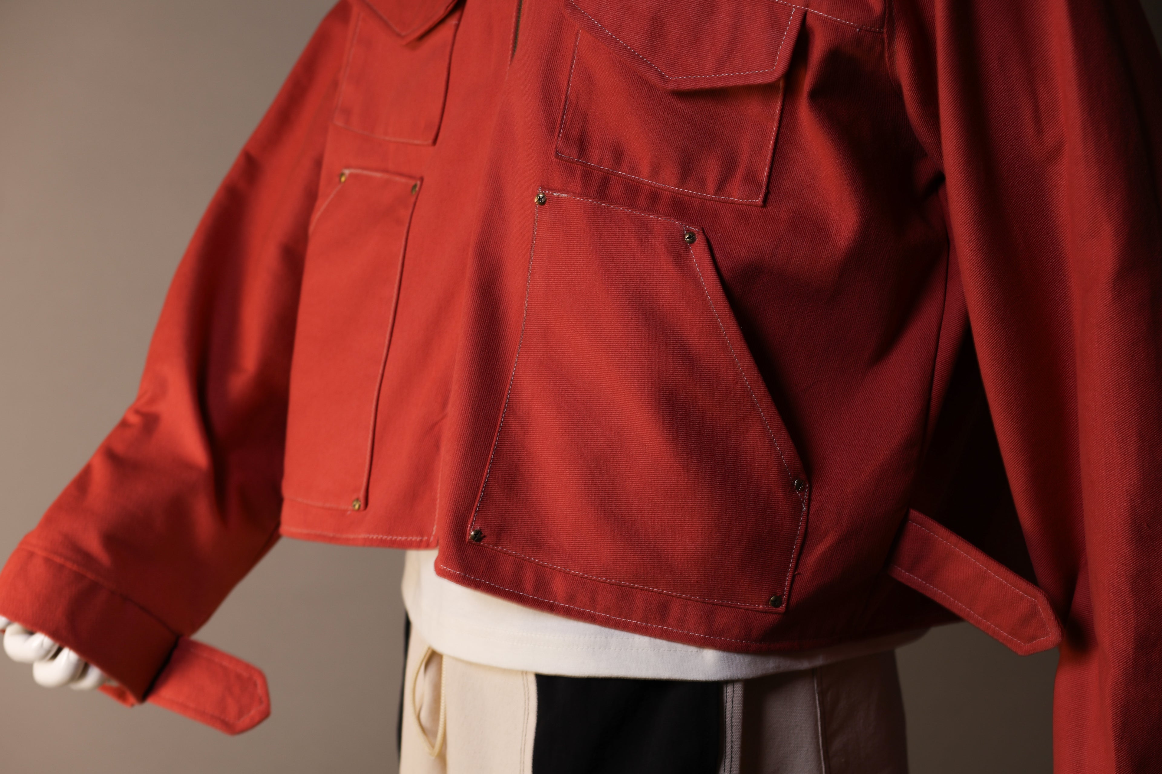 Red jacket with a neutral background